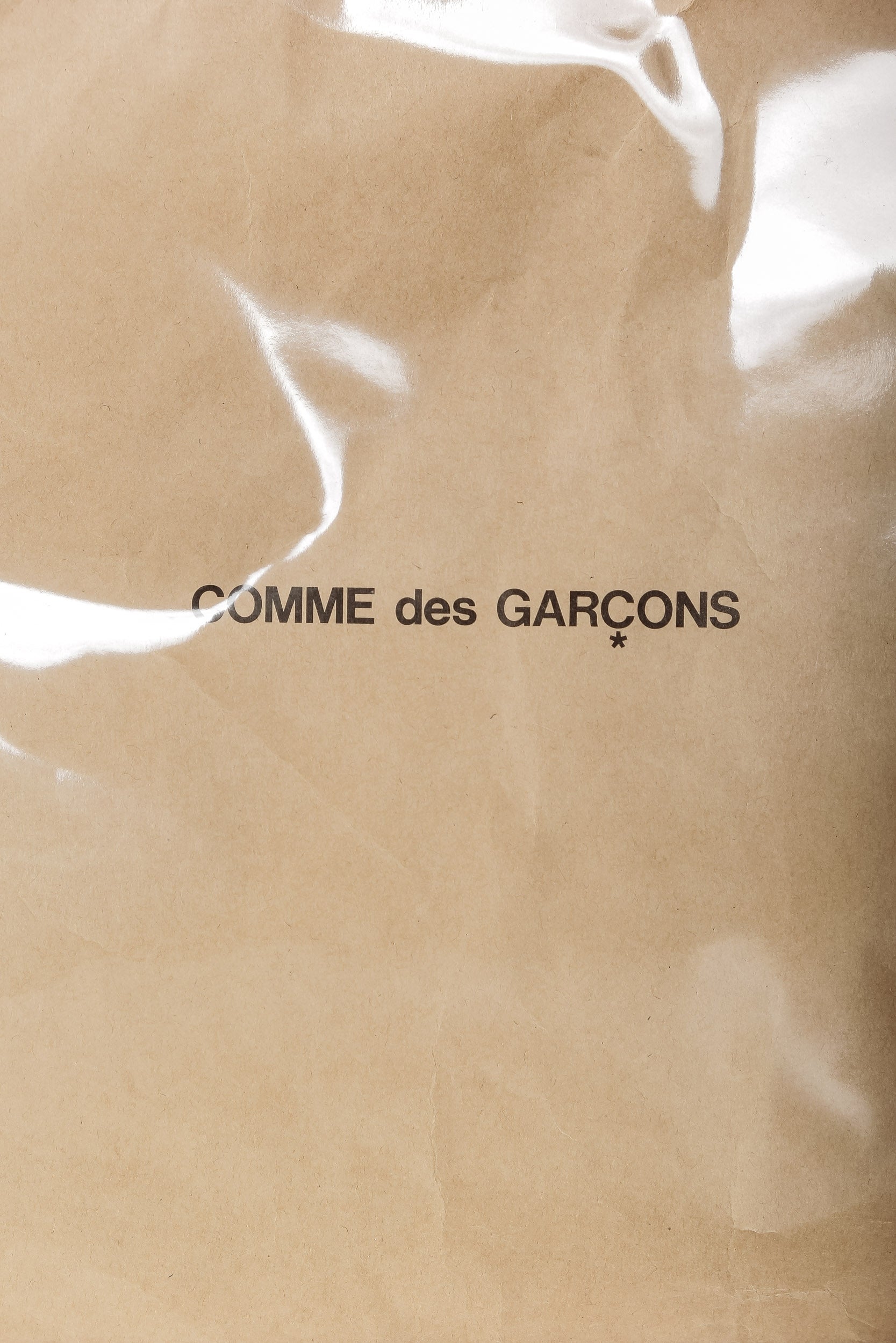 Comme Des Garçons Handtasche mit Logo-Print beige