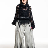 Bild‑Alt‑Texte
Yohji Yamamoto Strick‑Top hochgeschlossen schwarz